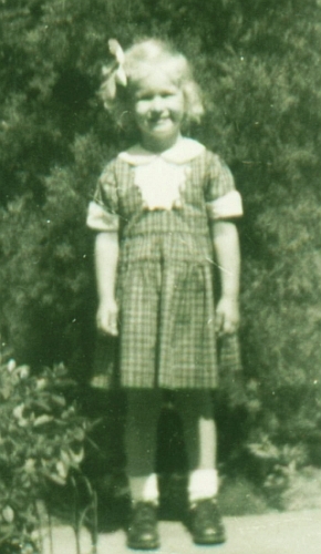 Carol next to the hedge