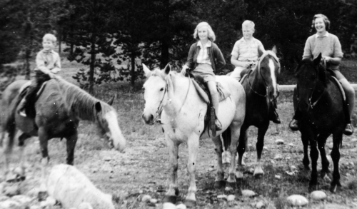 The entire family on horseback.